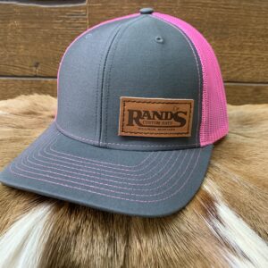 Rand’s Custom Hand Stitched baseball caps in Grey and Hot pink. Mid profile snapback mesh trucker hat with a leather stitched patch