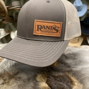 Rand’s Custom Hand Stitched baseball caps In tan and brown Mid profile snapback mesh trucker hat with a leather stitched patch